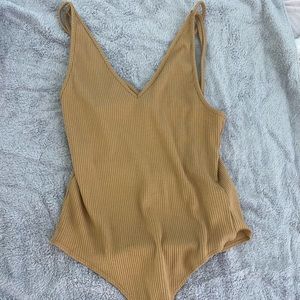 Tan body suit